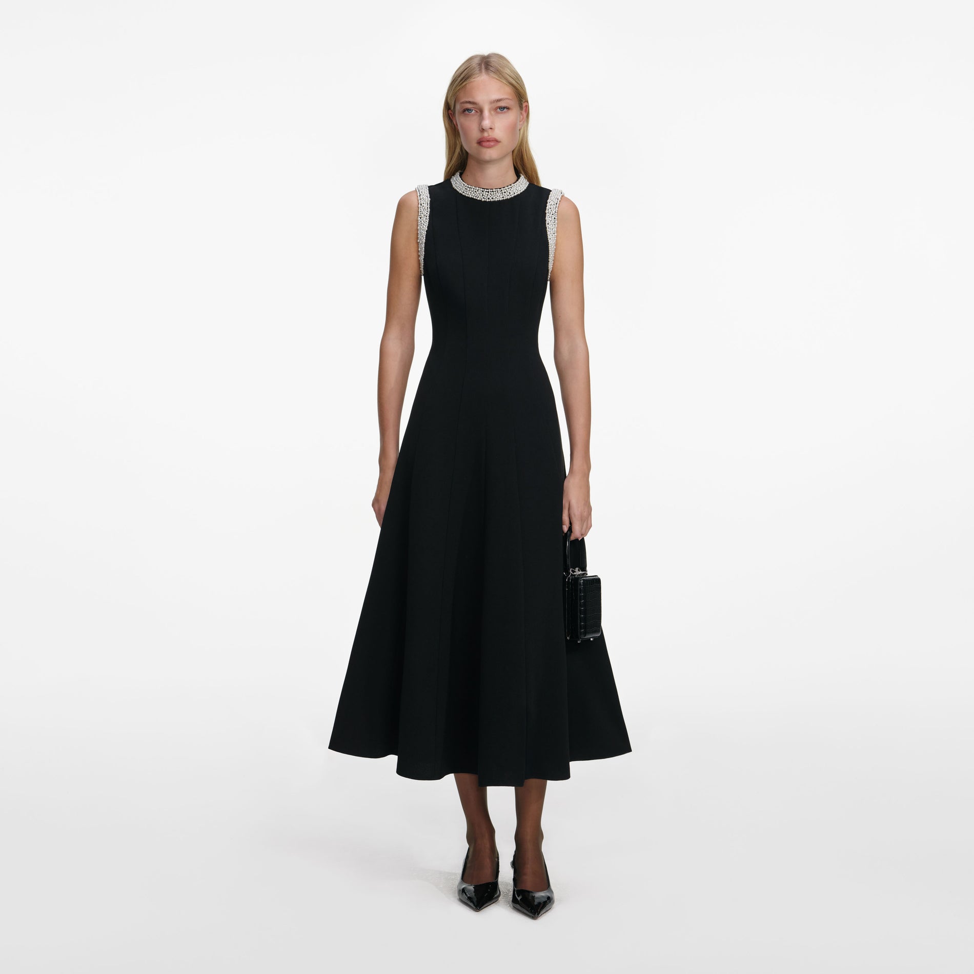 Front view of a woman wearing the Black Crepe Pearl Trim Midi Dress