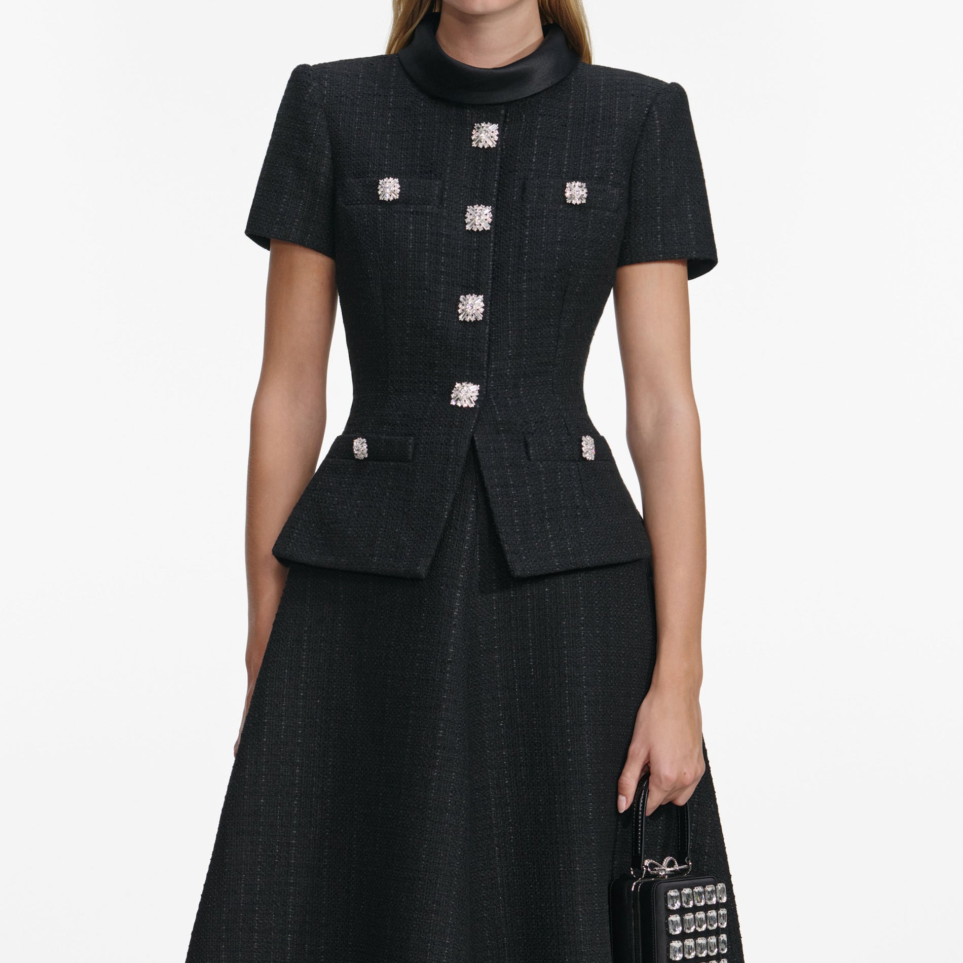 A close up of a woman wearing the Black Boucle Collared Midi Dress