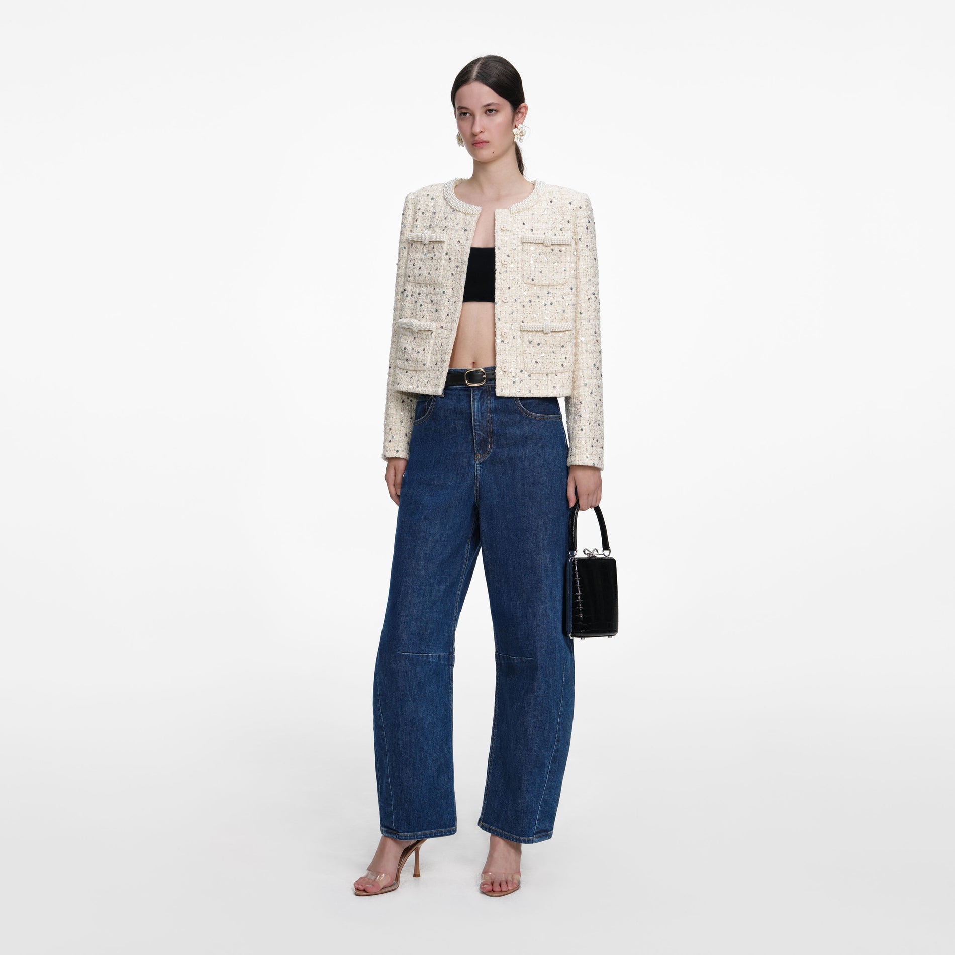 Side view of a woman wearing the Cream Embellished Boucle Jacket