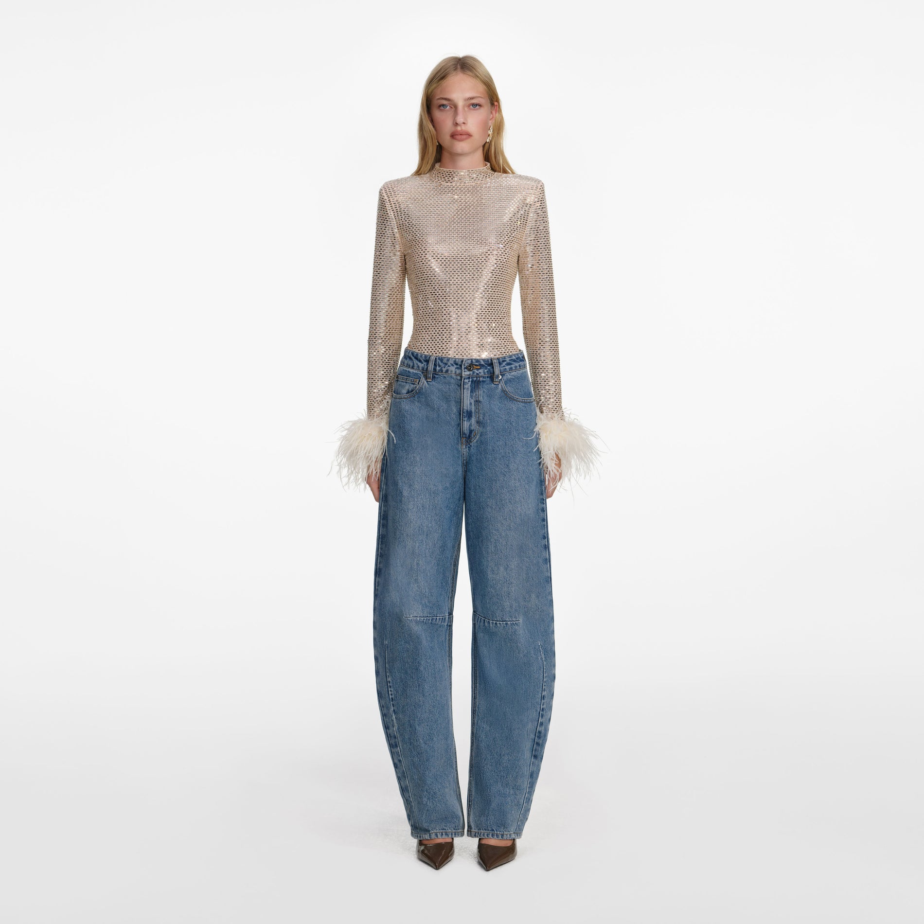 Front view of a woman wearing the Champagne Rhinestone Feather Top