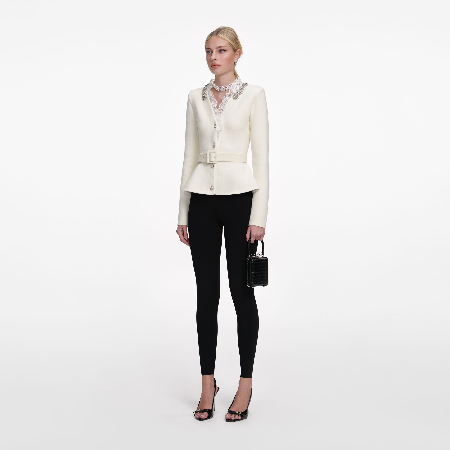Side view of a woman wearing the Cream Crystal Trim Cardigan