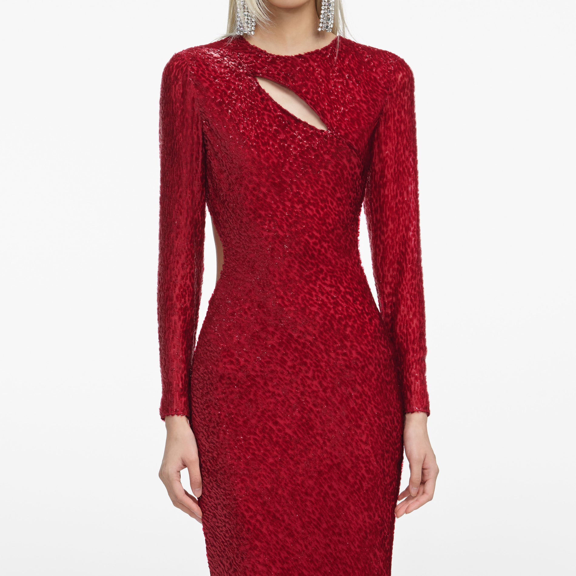 A close up of a woman wearing the Red Fil Coupe Maxi Dress