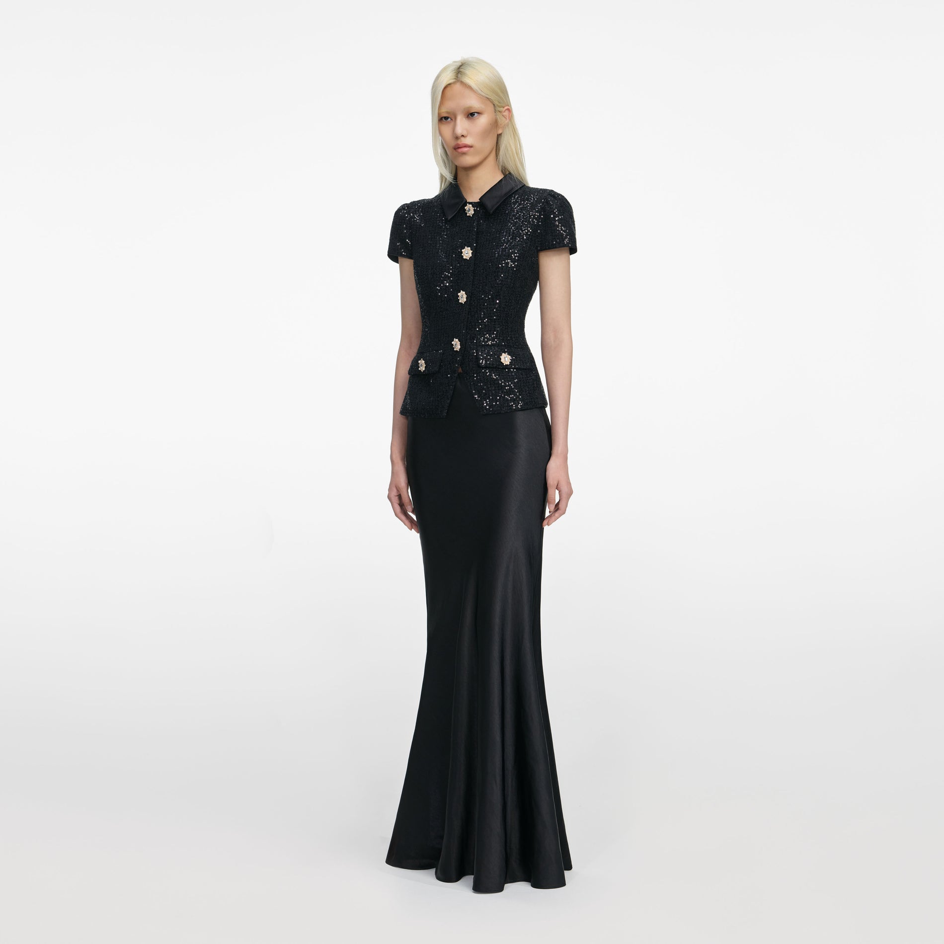 Side view of a woman wearing the Black Sequin Boucle Satin Maxi Dress