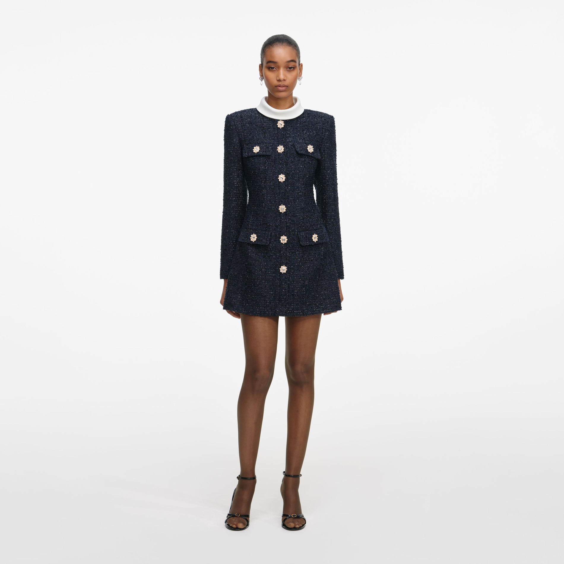 Front view of a woman wearing the Navy Boucle Long Sleeve Mini Dress