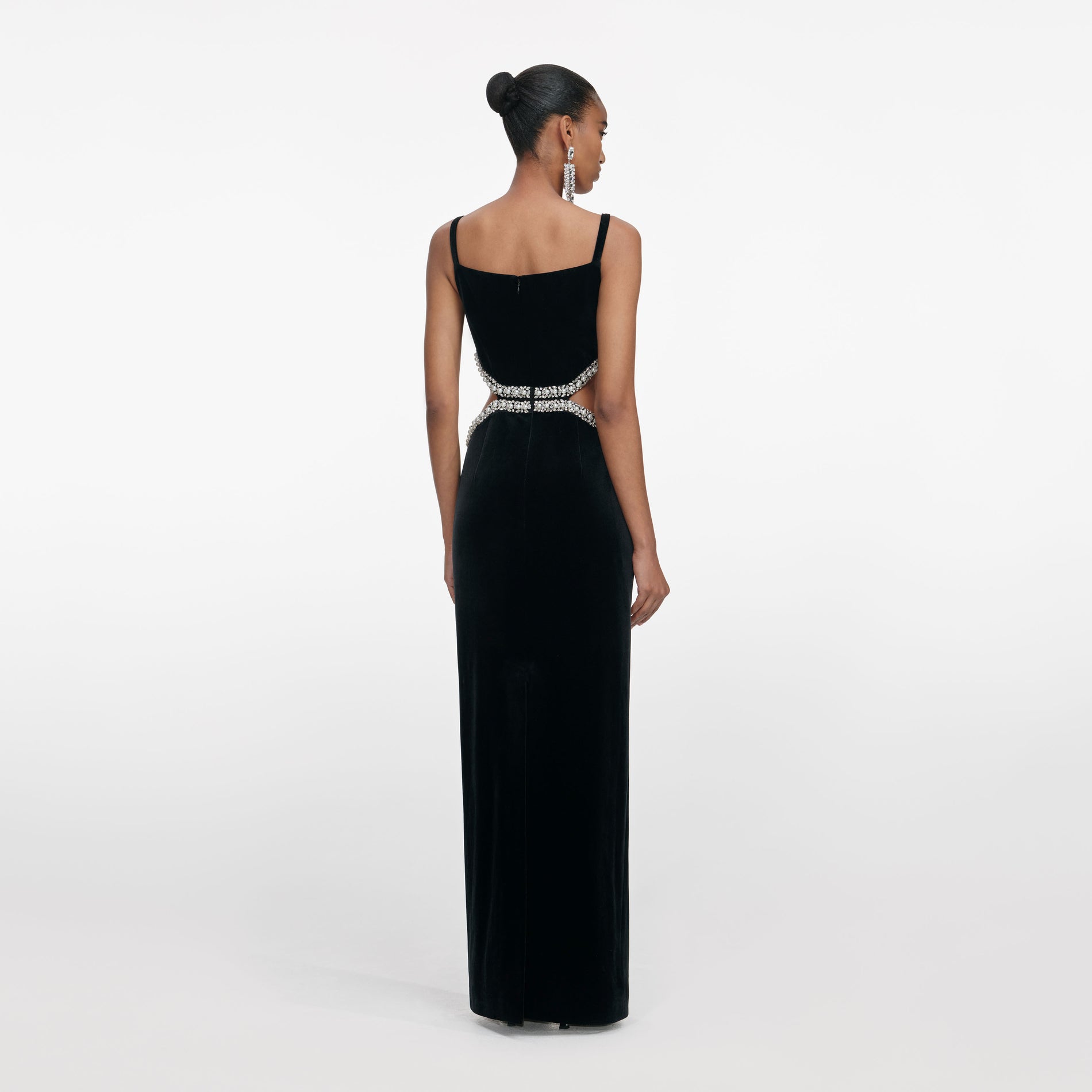 Back view of a woman wearing the Black Velvet Cut Out Maxi Dress