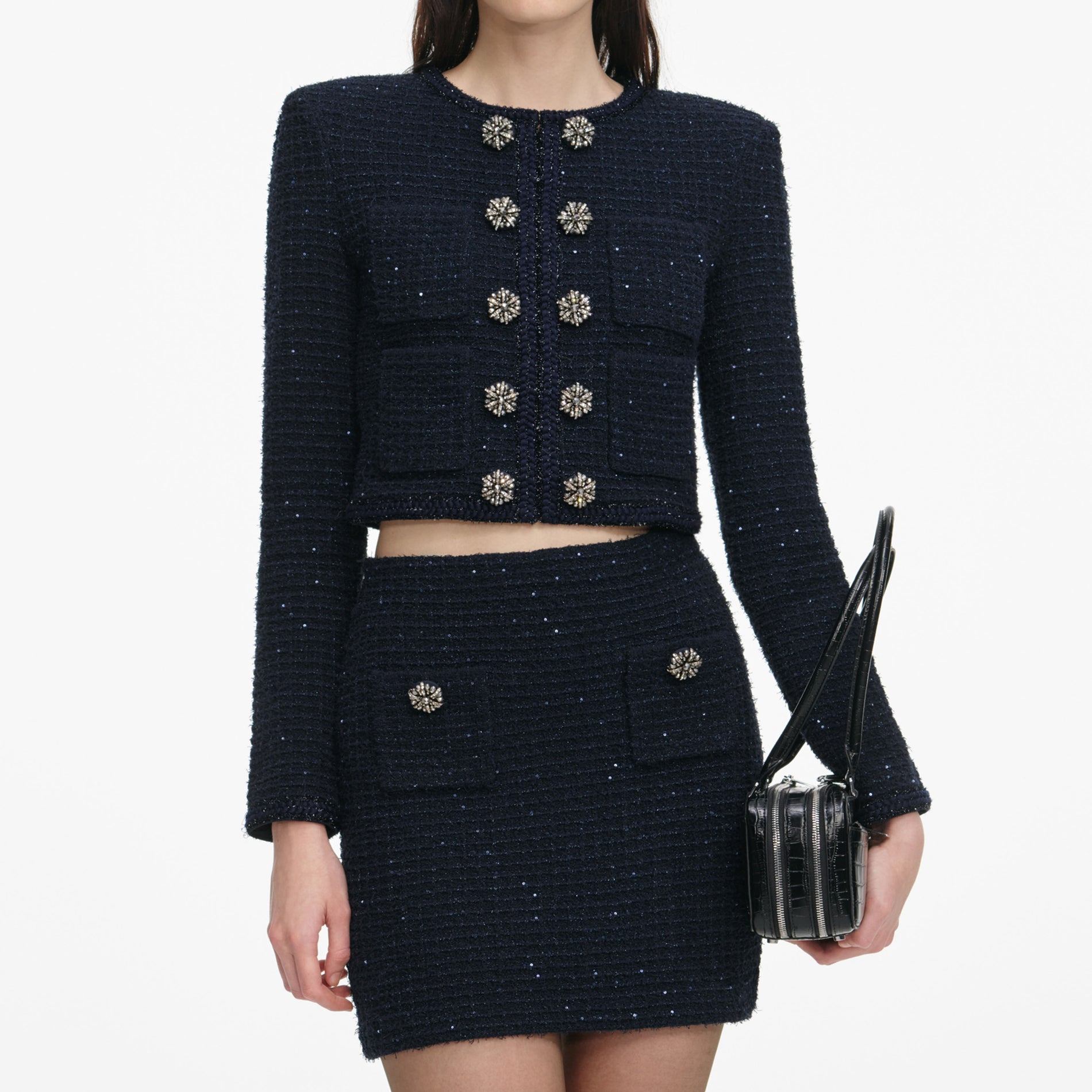 A close up of a woman wearing the Navy Textured Knit Mini Skirt