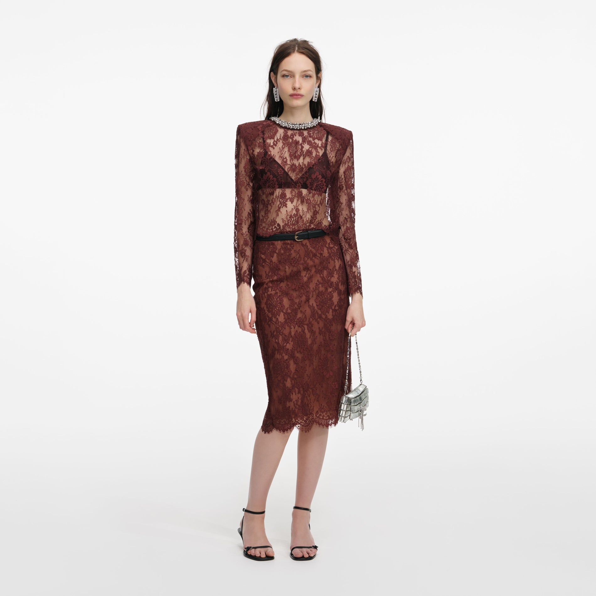 Front view of a woman wearing the Brown Floral Lace Midi Skirt