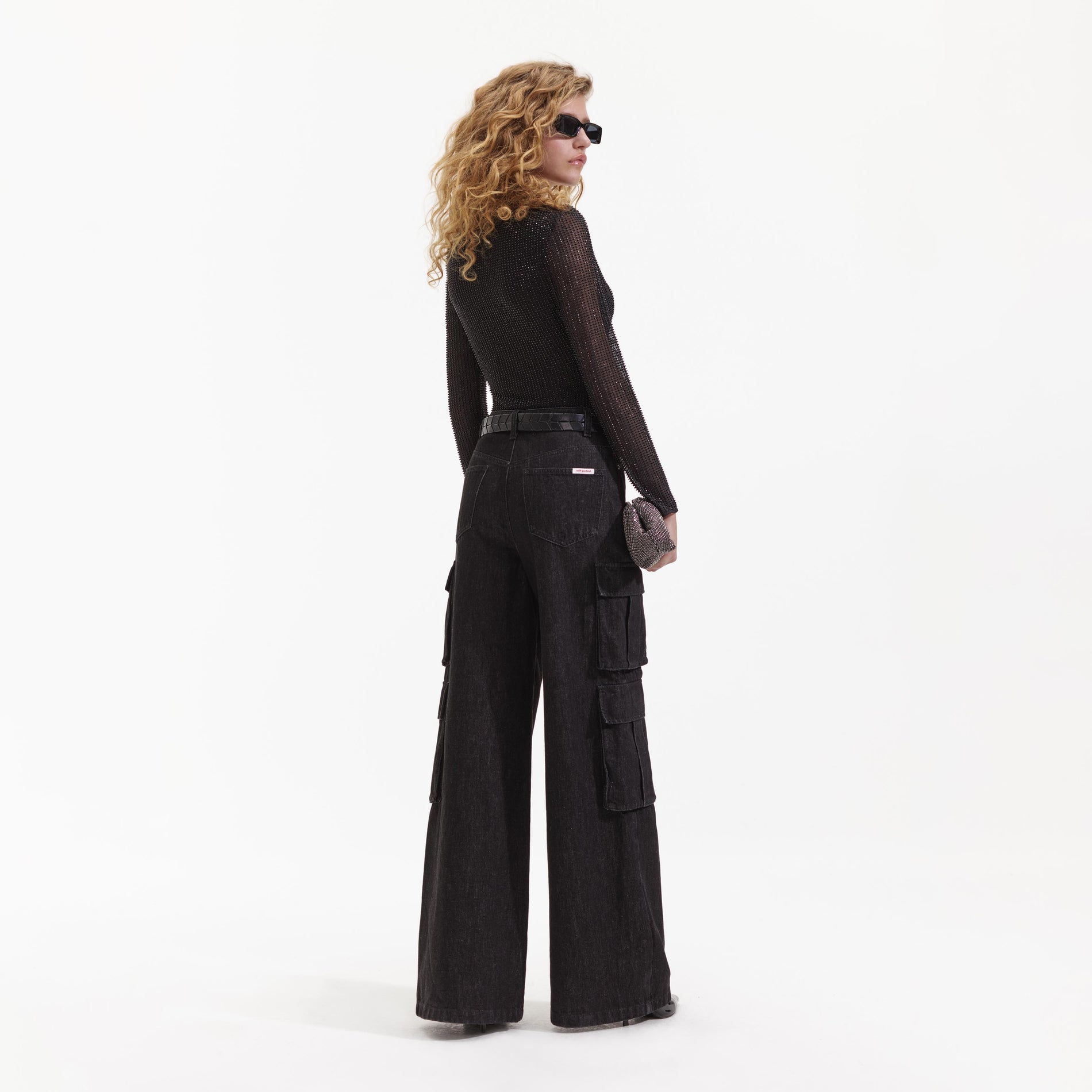 Back view of a woman wearing the Black Beaded Mesh Top