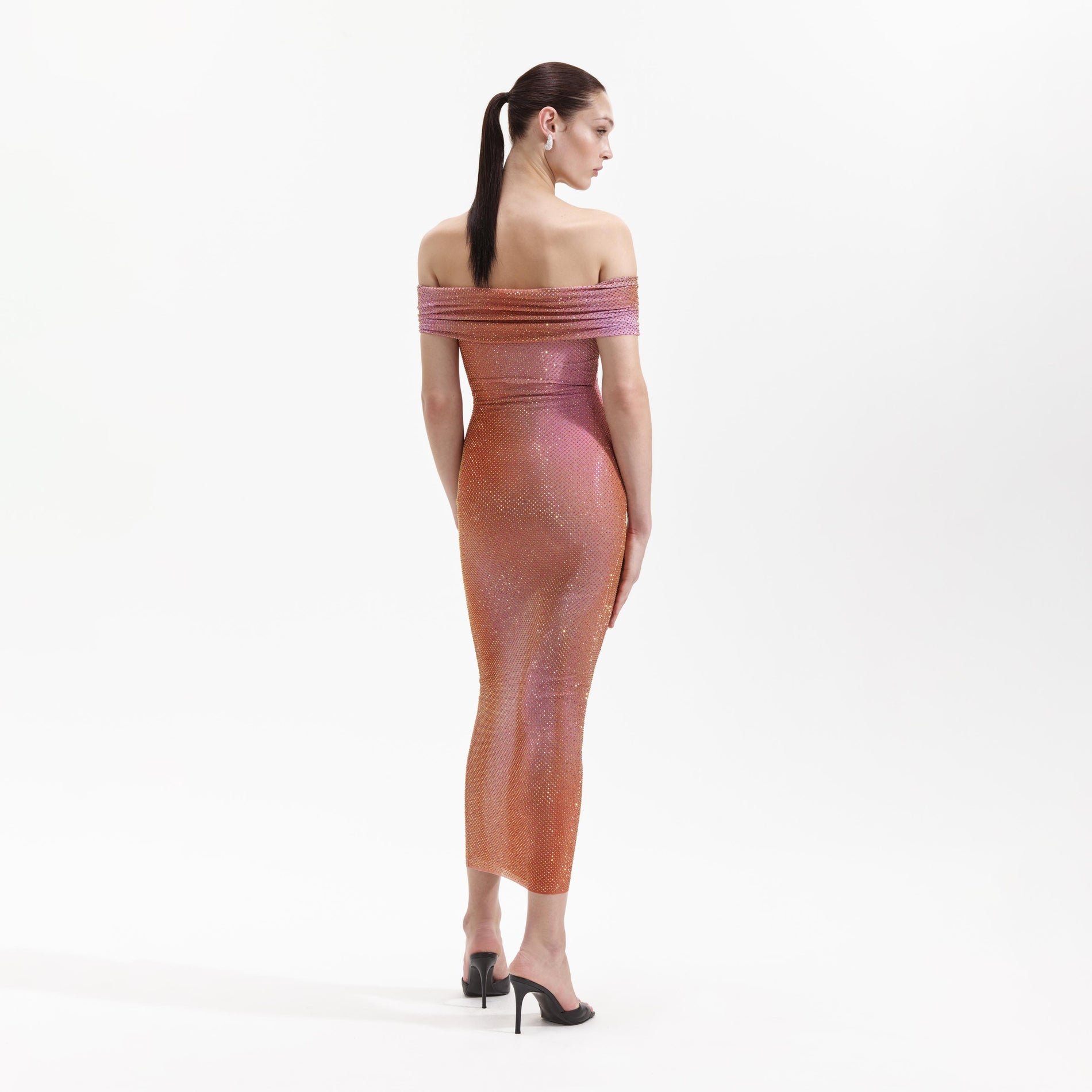 Back view of a woman wearing the Orange Rhinestone Midi Dress