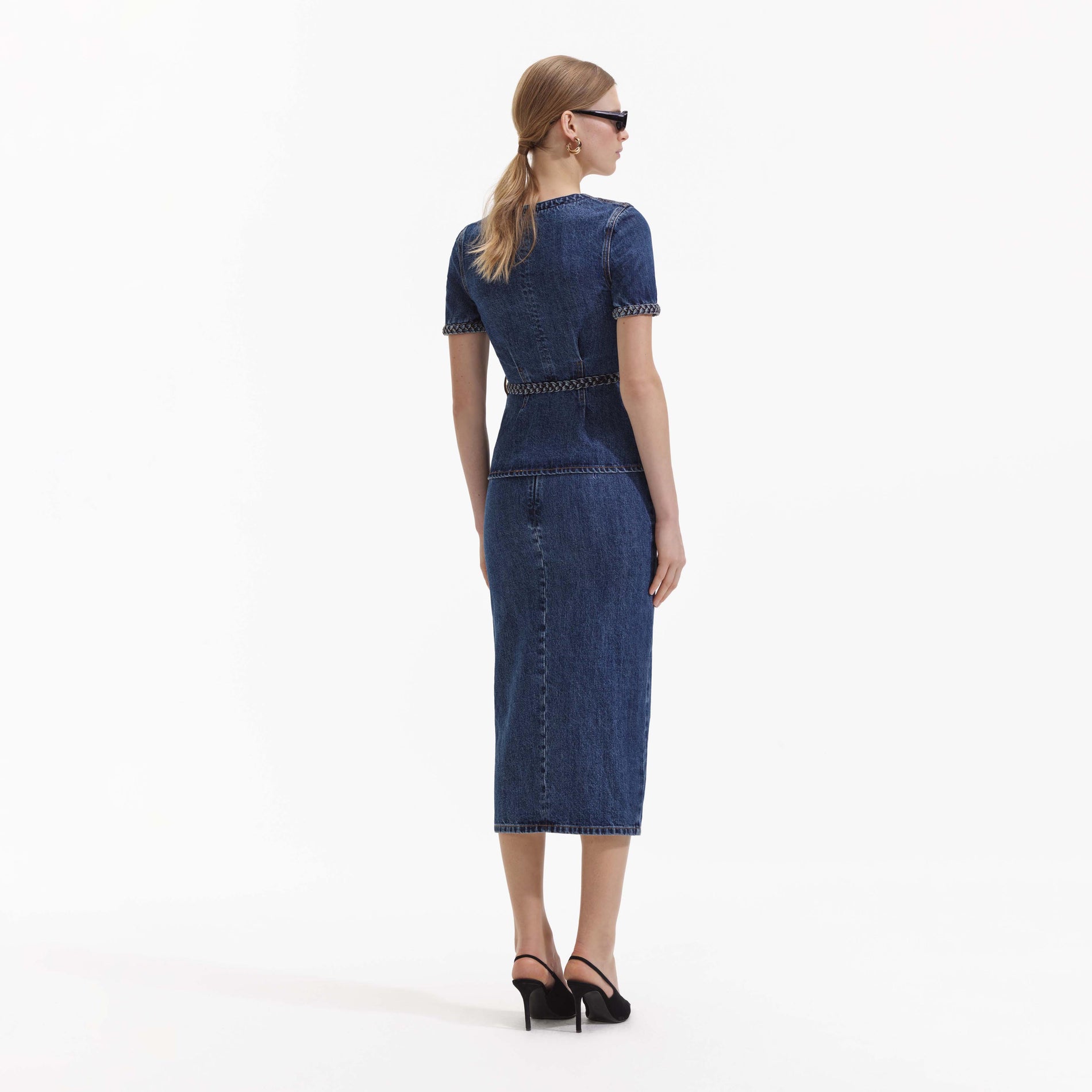 Back view of a woman wearing the Denim Midi Dress