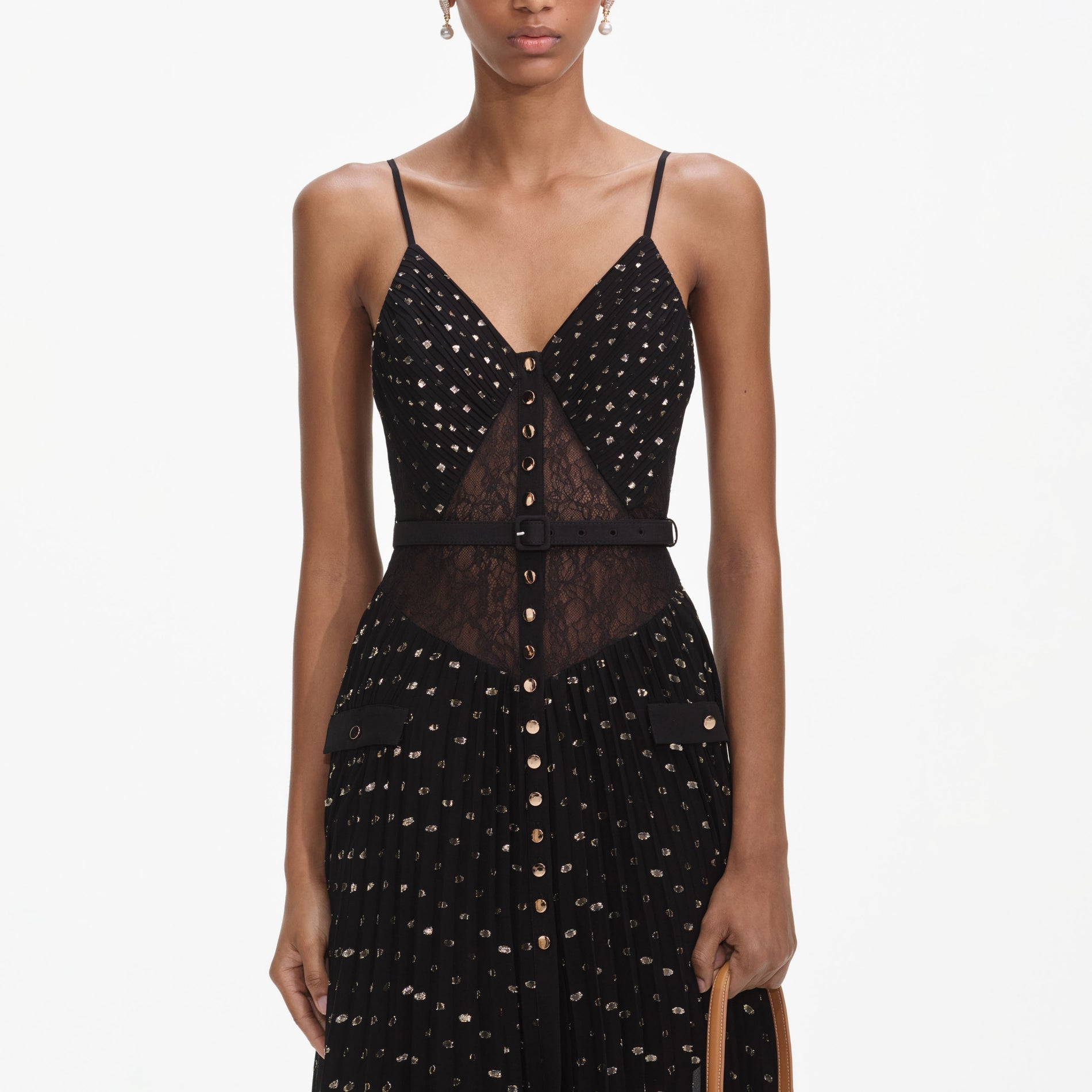 A close up of a woman wearing the Black And Gold Chiffon Maxi Dress