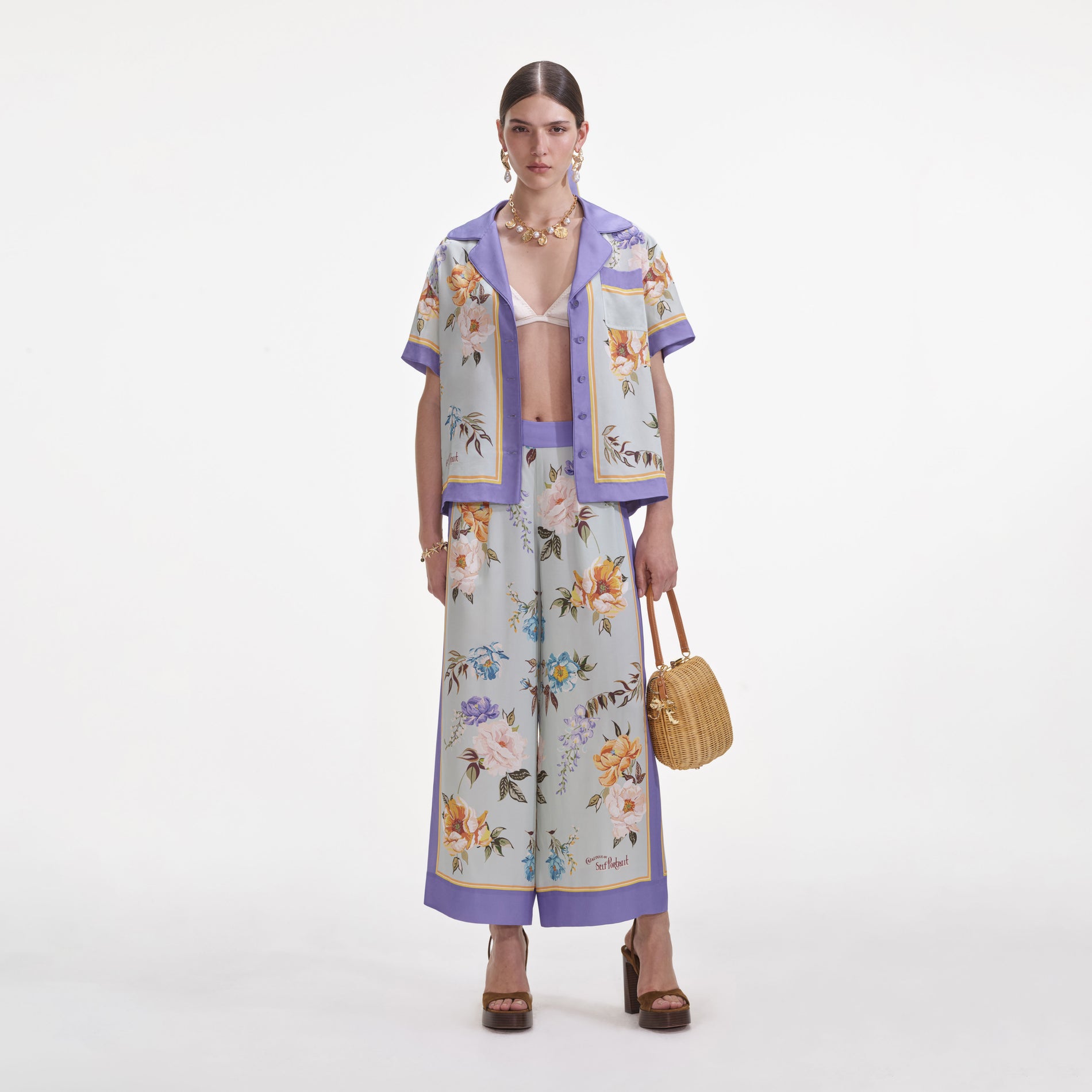 Front view of a woman wearing the Blue Floral Viscose Trousers