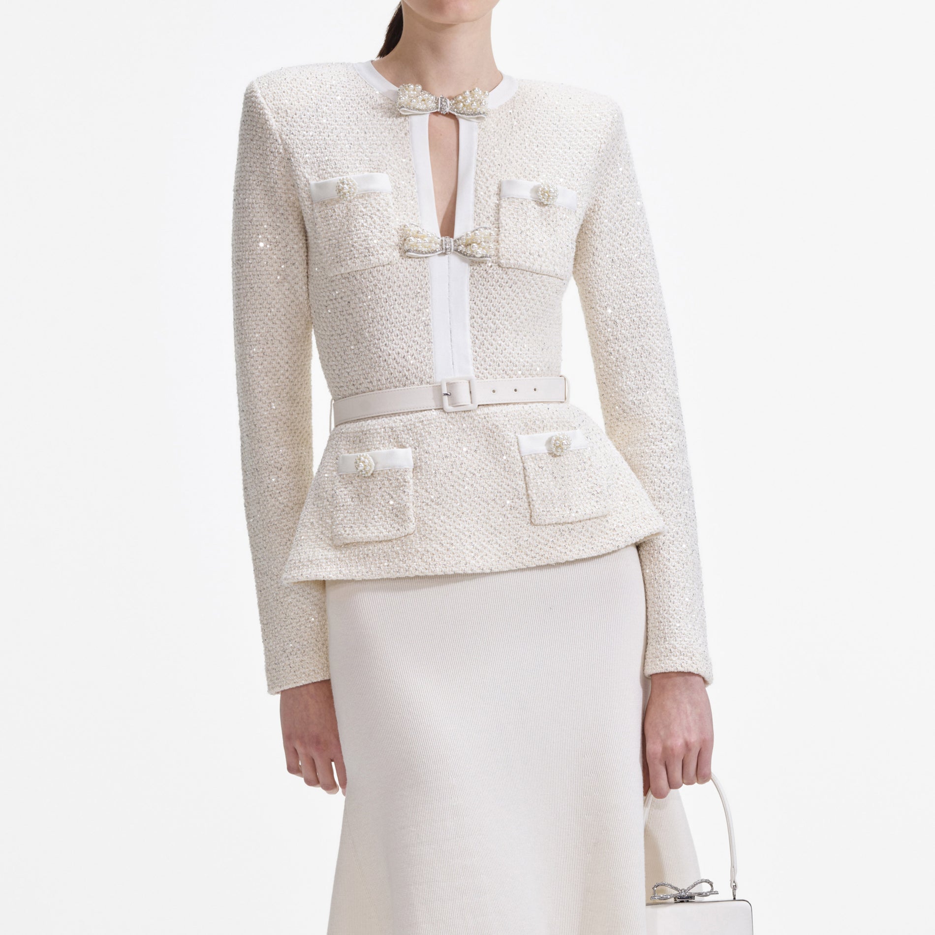 A close up of a woman wearing the Cream Sequin Knit Tailored Midi Dress