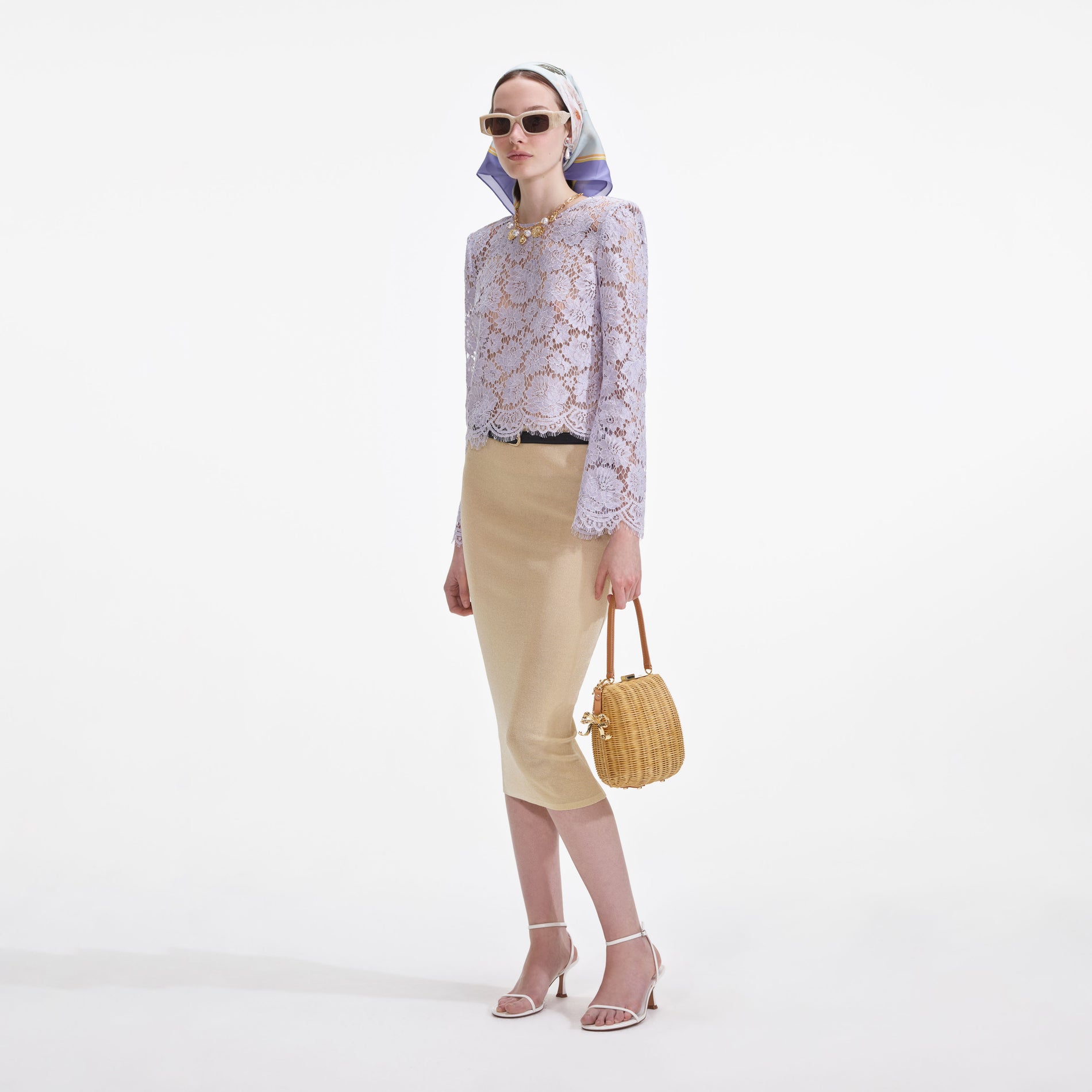 Side view of a woman wearing the Yellow Viscose Knit Midi Skirt