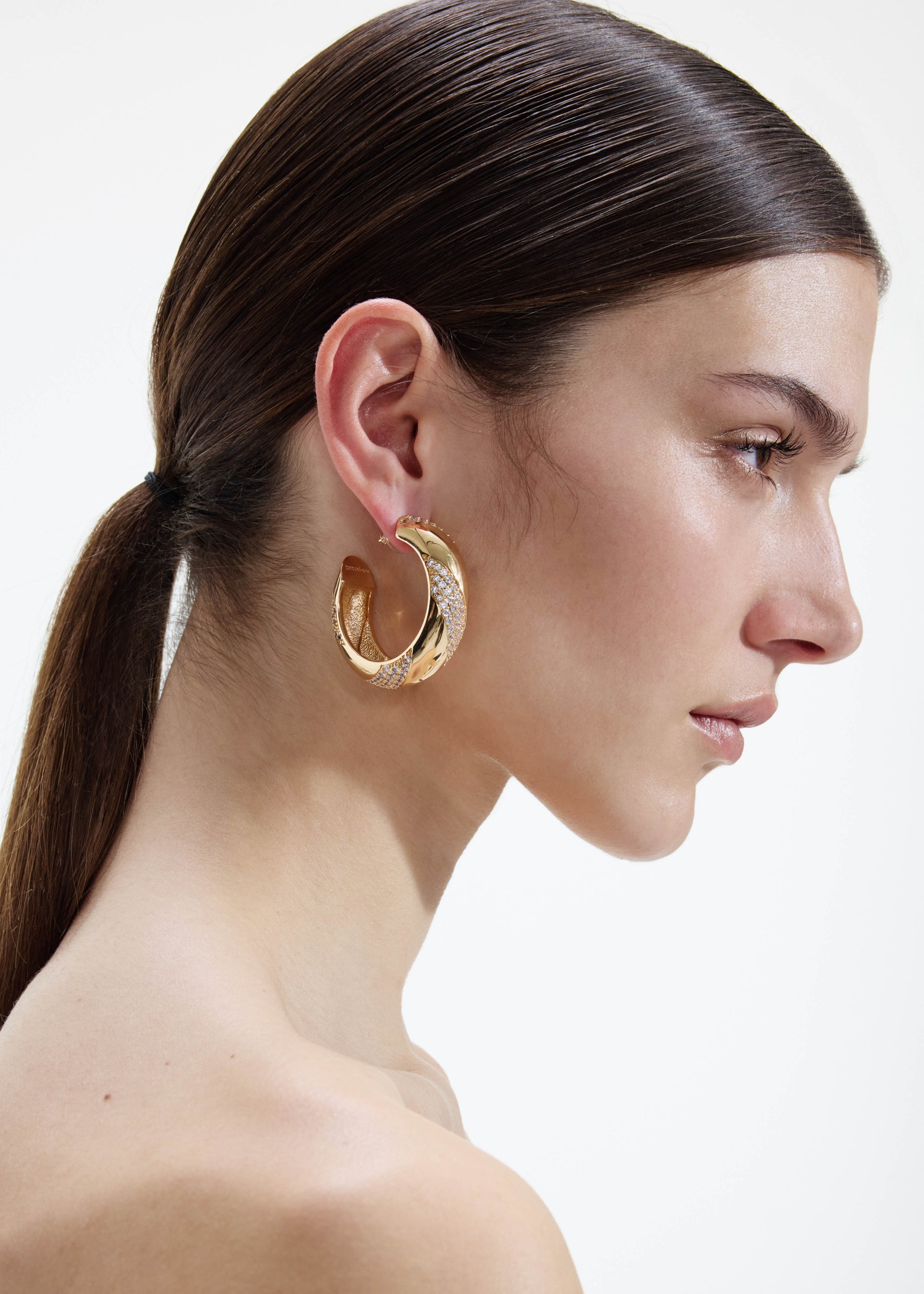 A photo of the Gold And Crystal Hoop Earrings