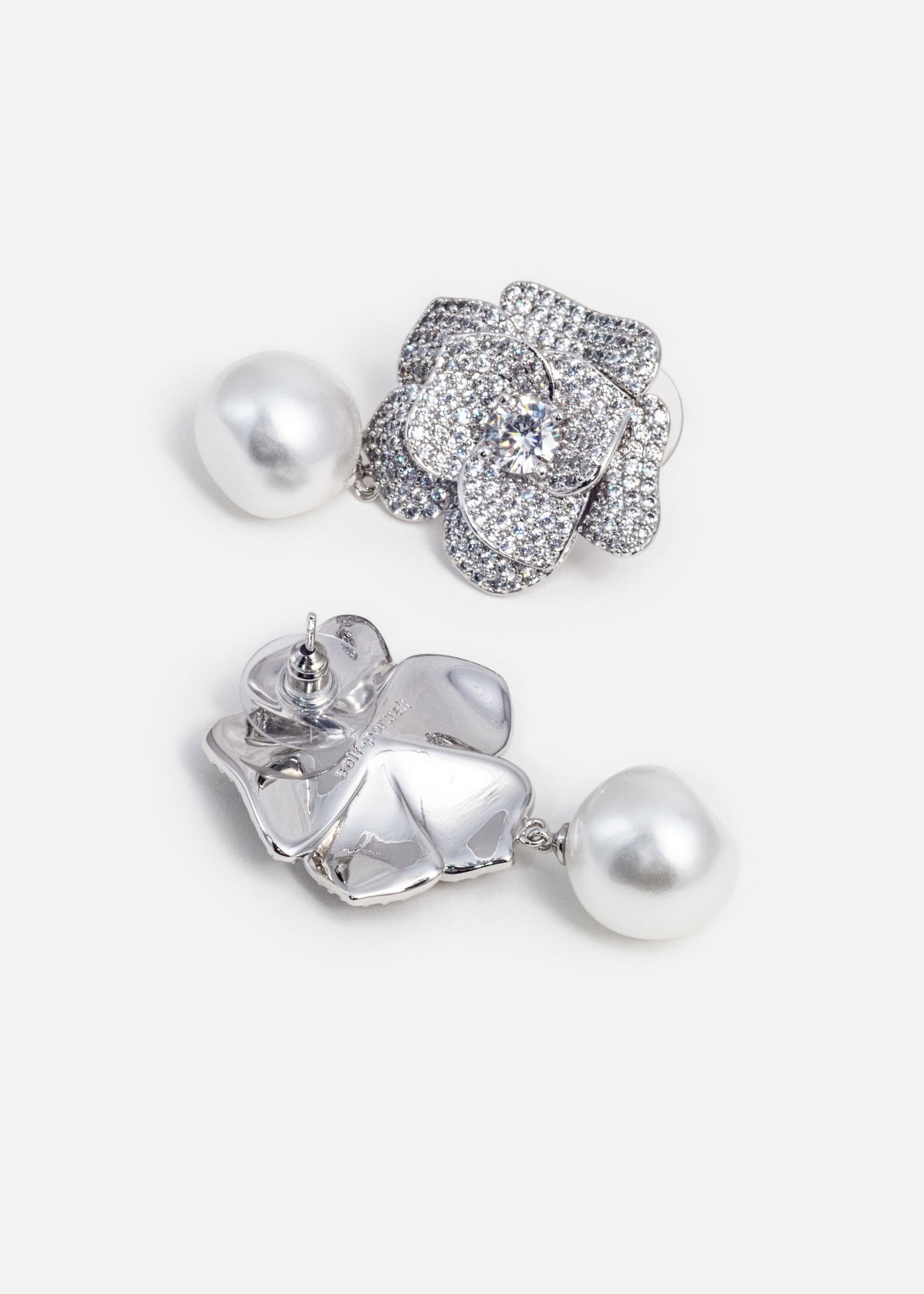 A photo of the Crystal Flower Pearl Earrings