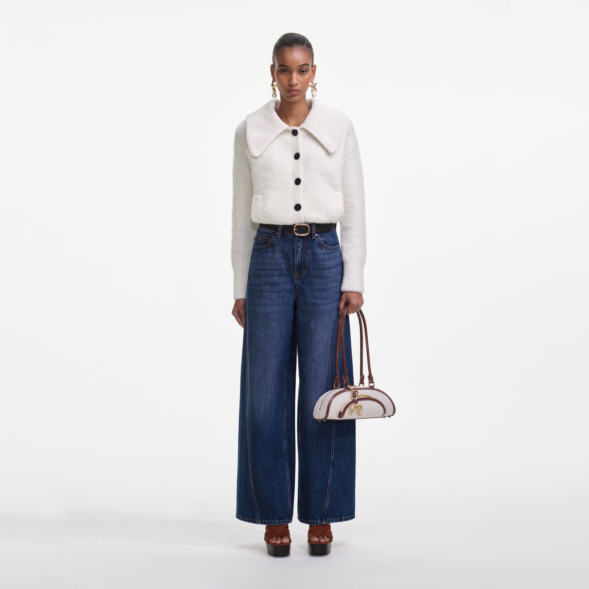 Front view of a woman wearing the Bleached Denim Jeans