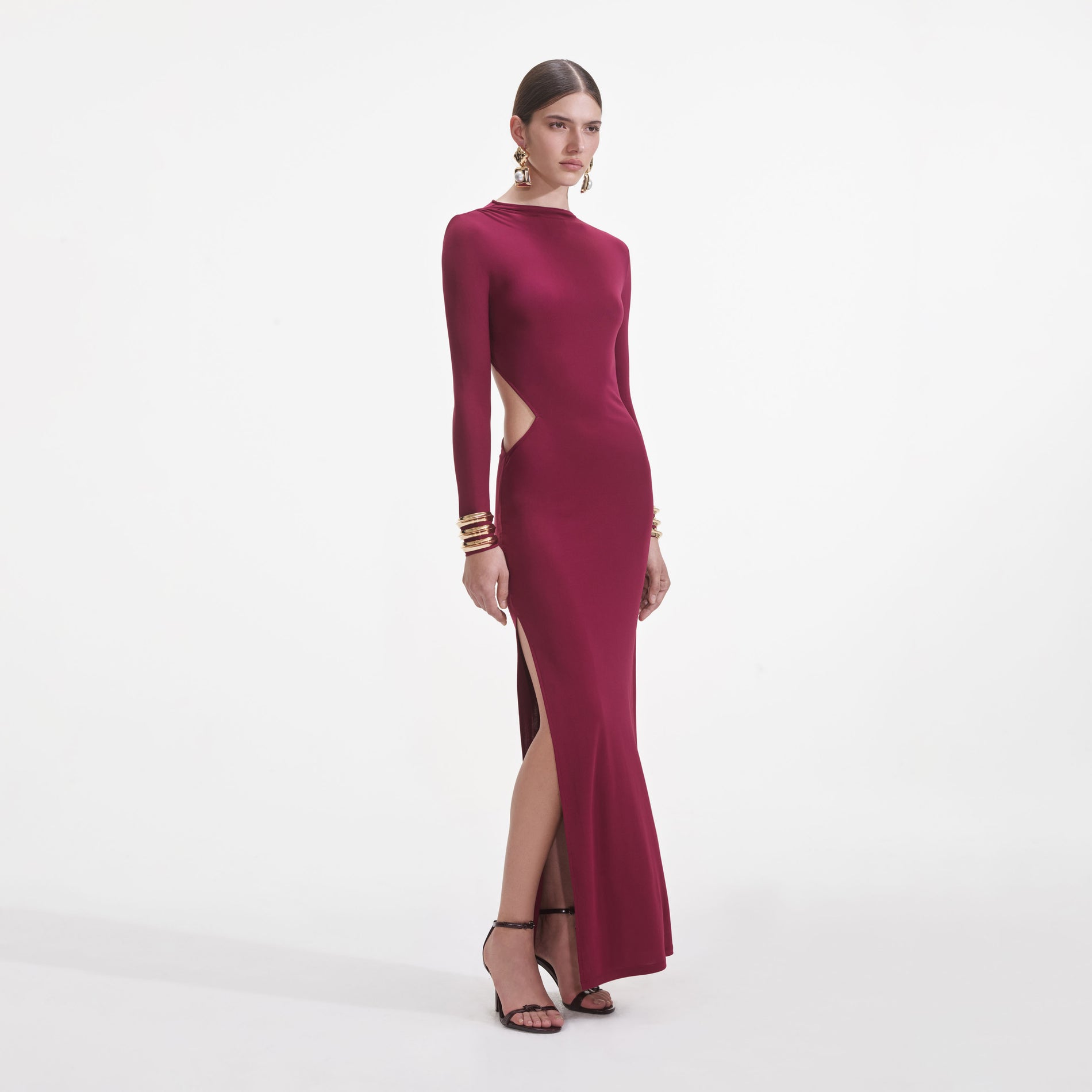Side view of a woman wearing the Burgundy Jersey Gathered Midi Dress