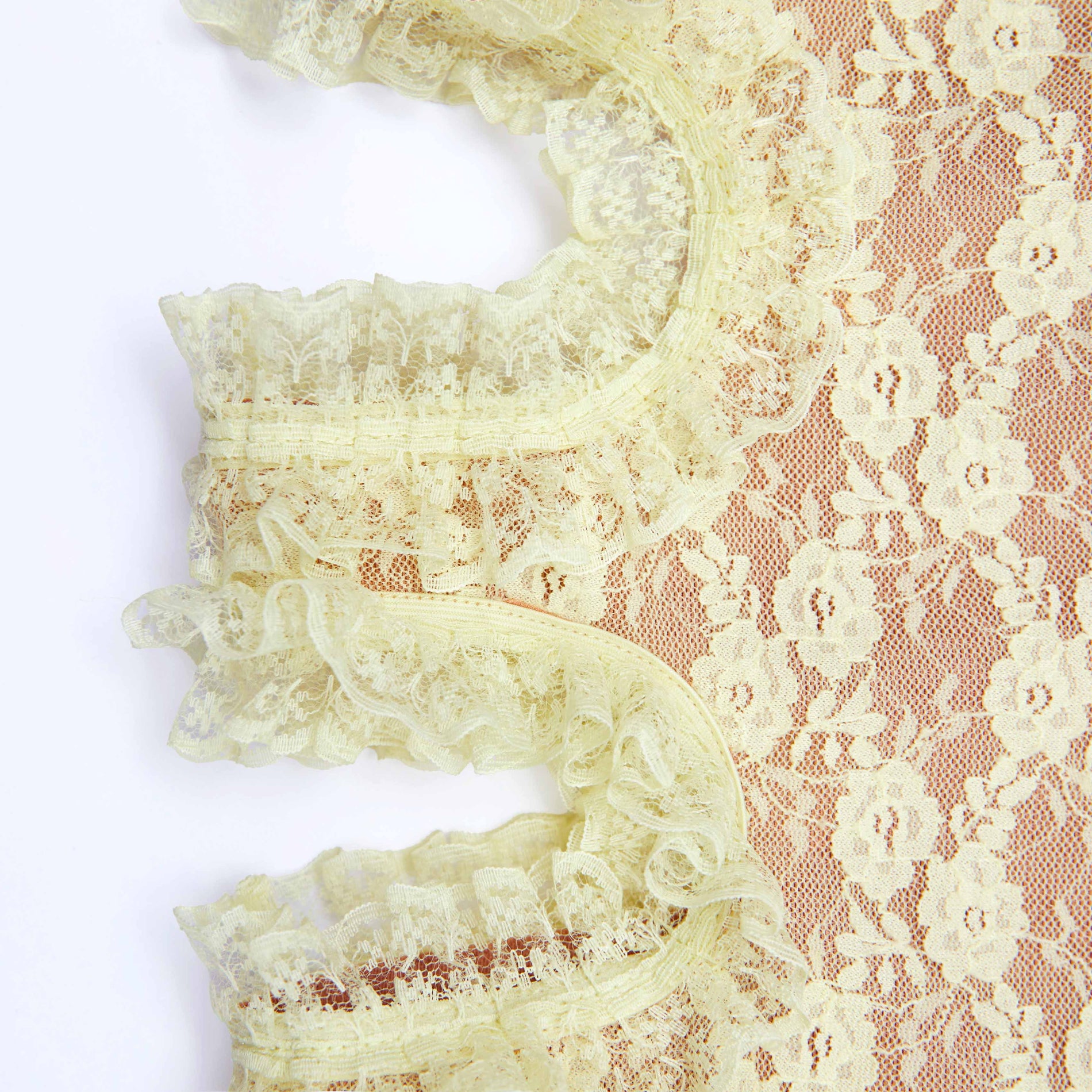 A close up of the fabric for the Yellow Lace Cut Out Midi Skirt