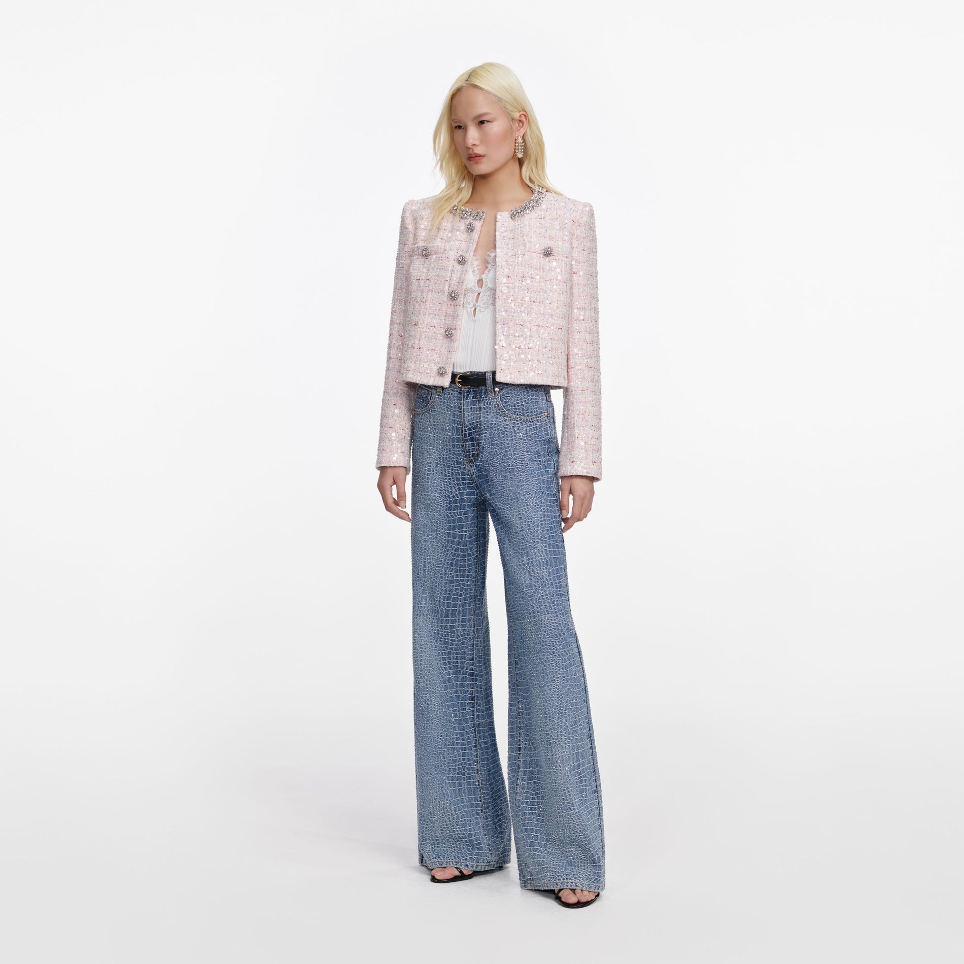 Side view of a woman wearing the Pink Sequin Boucle Jacket