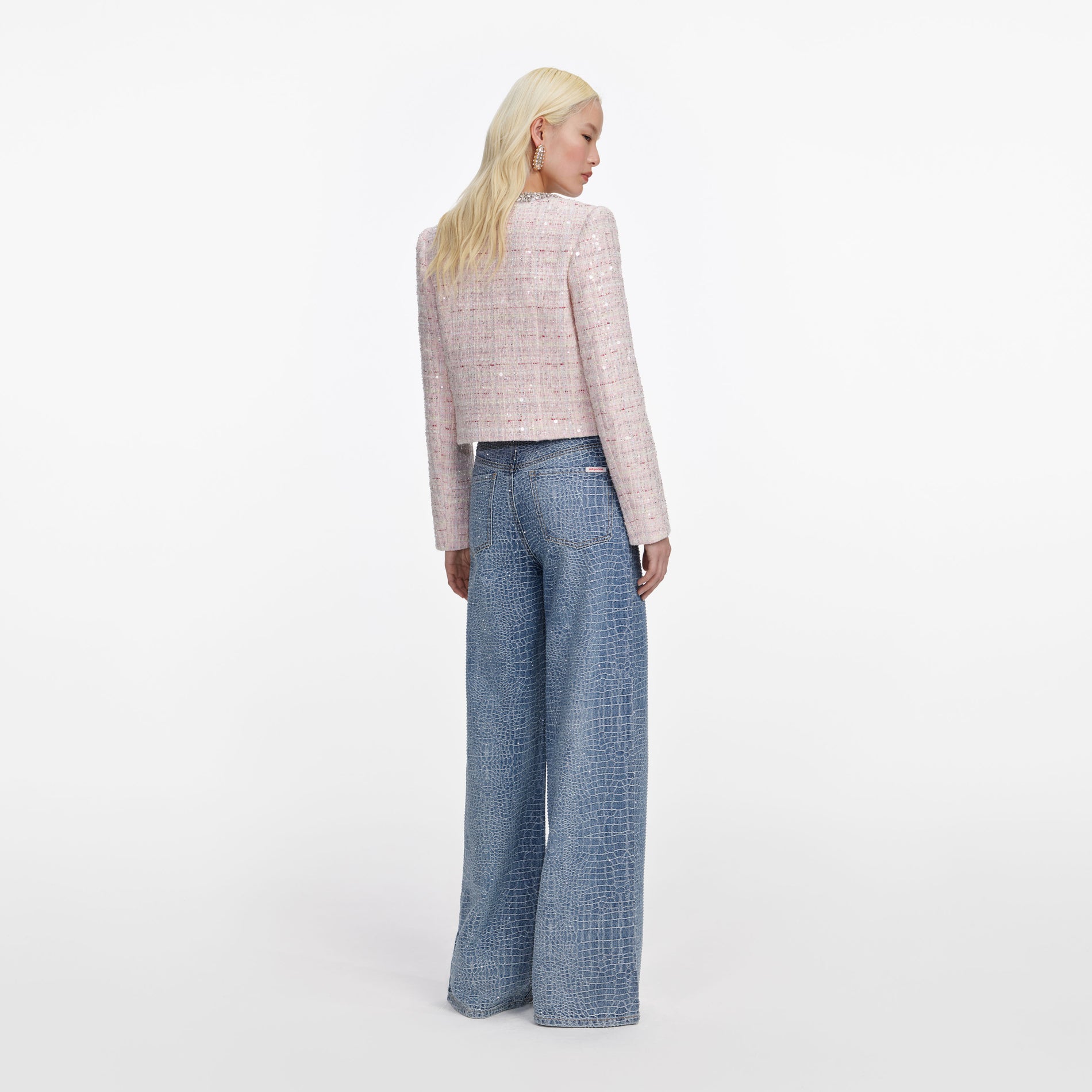 Back view of a woman wearing the Pink Sequin Boucle Jacket