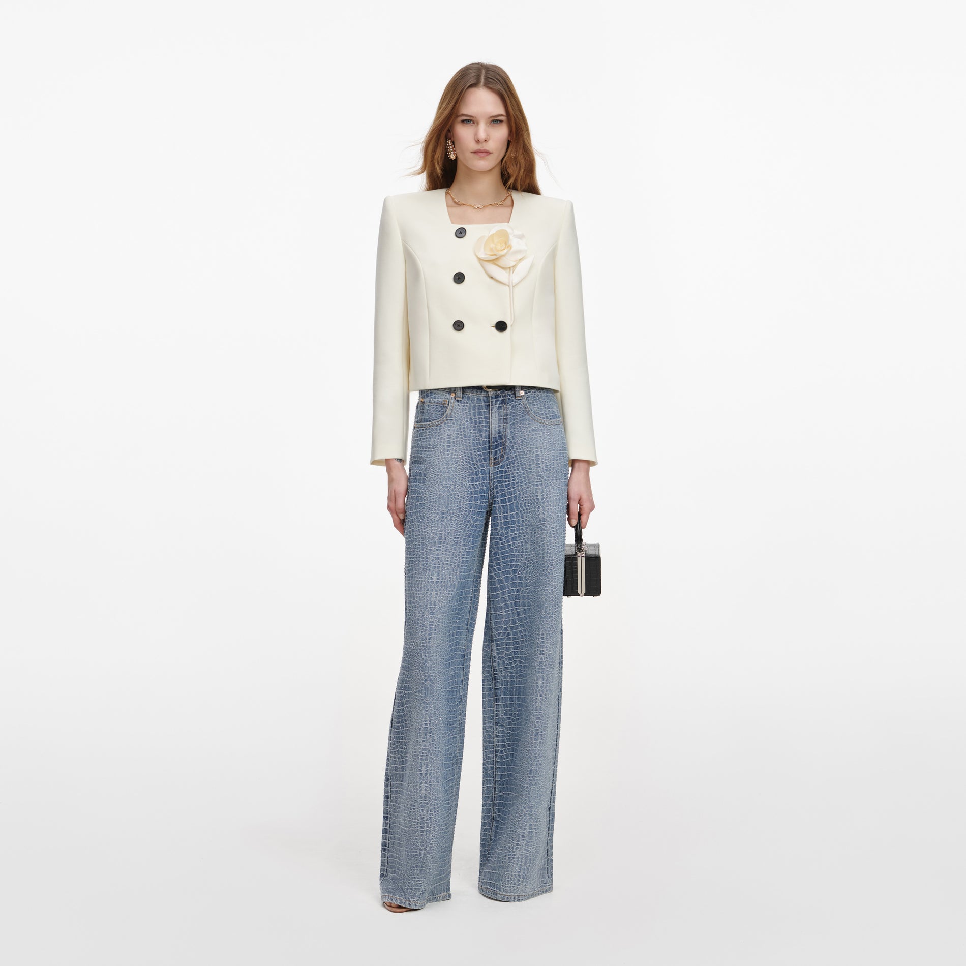 Front view of a woman wearing the Cream 3D Flower Jacket