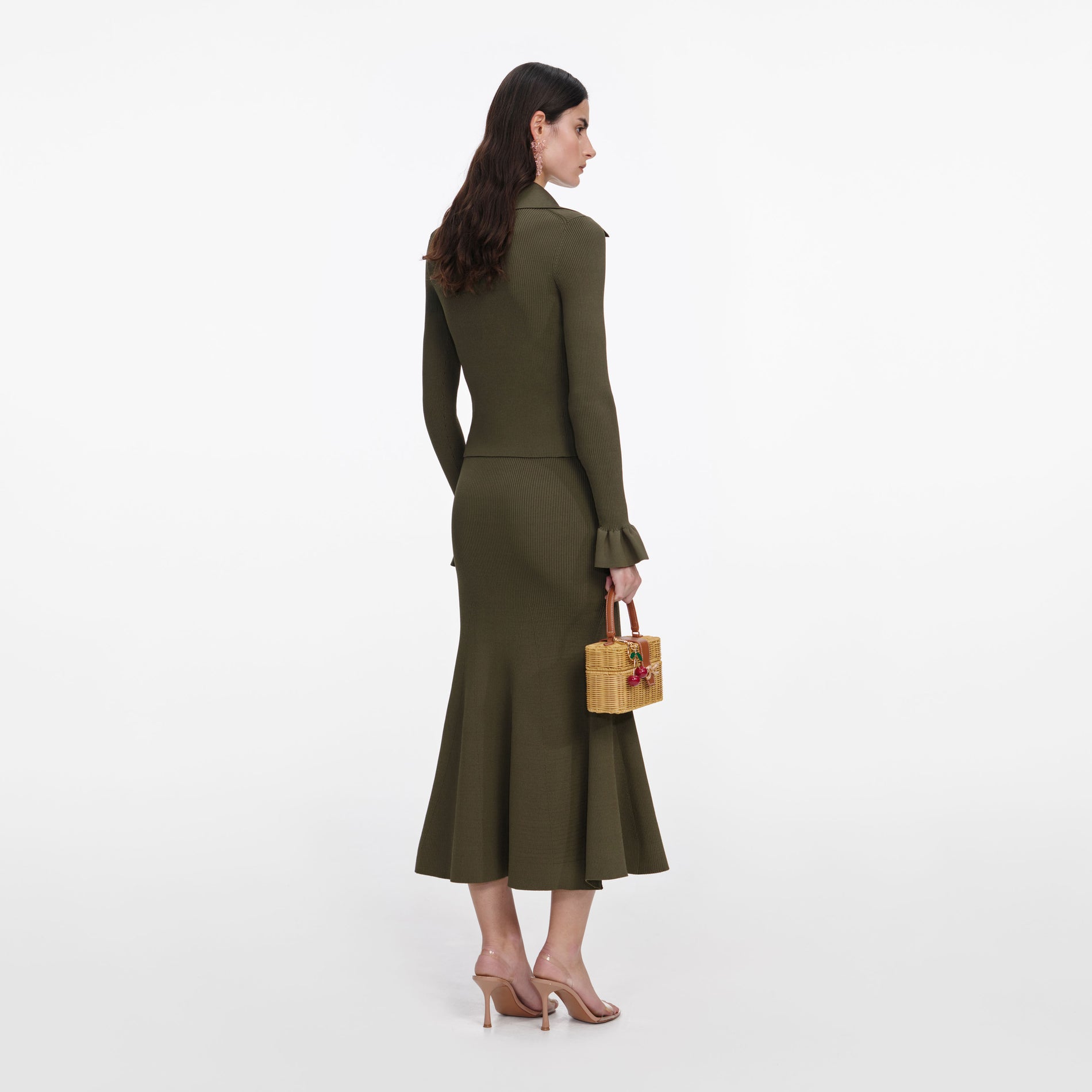 Back view of a woman wearing the Khaki Knit Midi Skirt