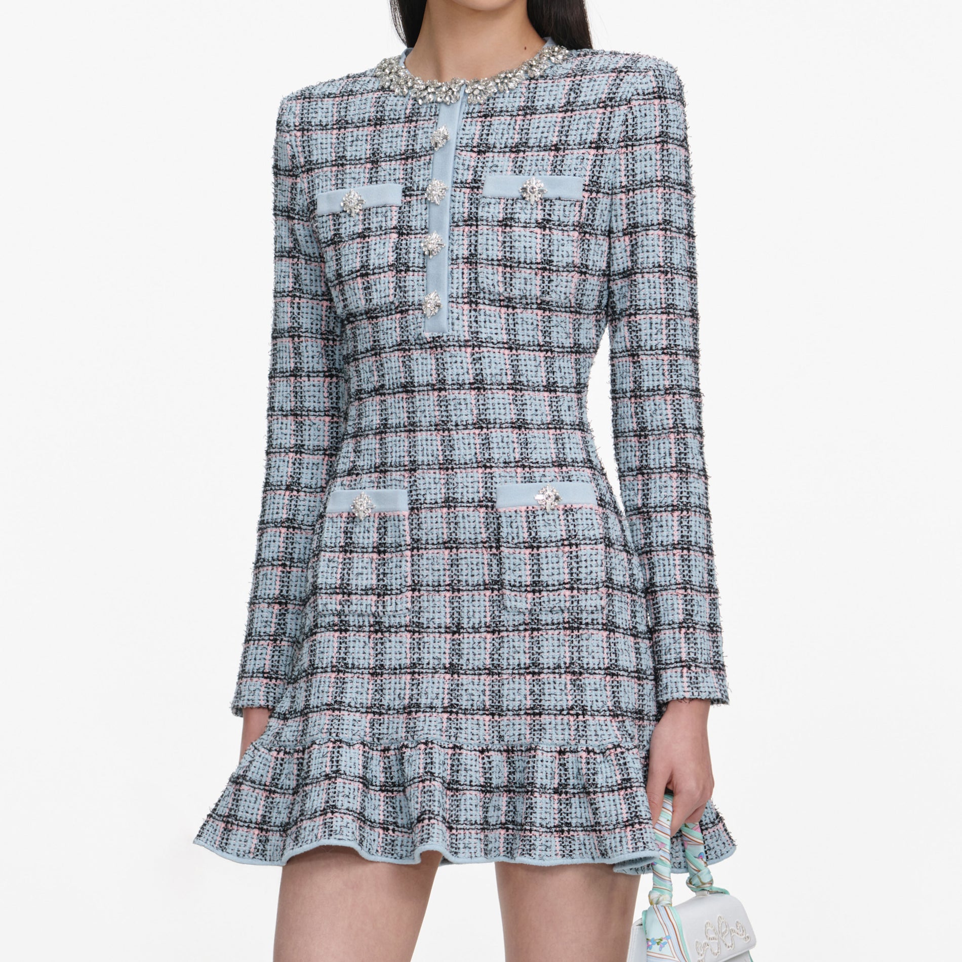 A close up of a woman wearing the Blue Check Knit Mini Dress